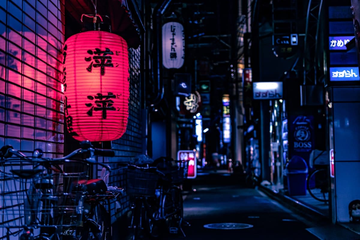 Tokyo city street glowing with neon signs at night